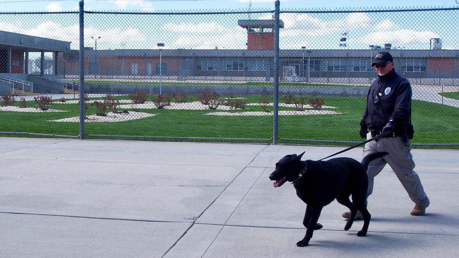 A corrections officer walks the grounds of the Idaho State Correctional Institution south of Boise where Adree Edmo was incarcerated. CREDIT: Heath Druzin/BSPR