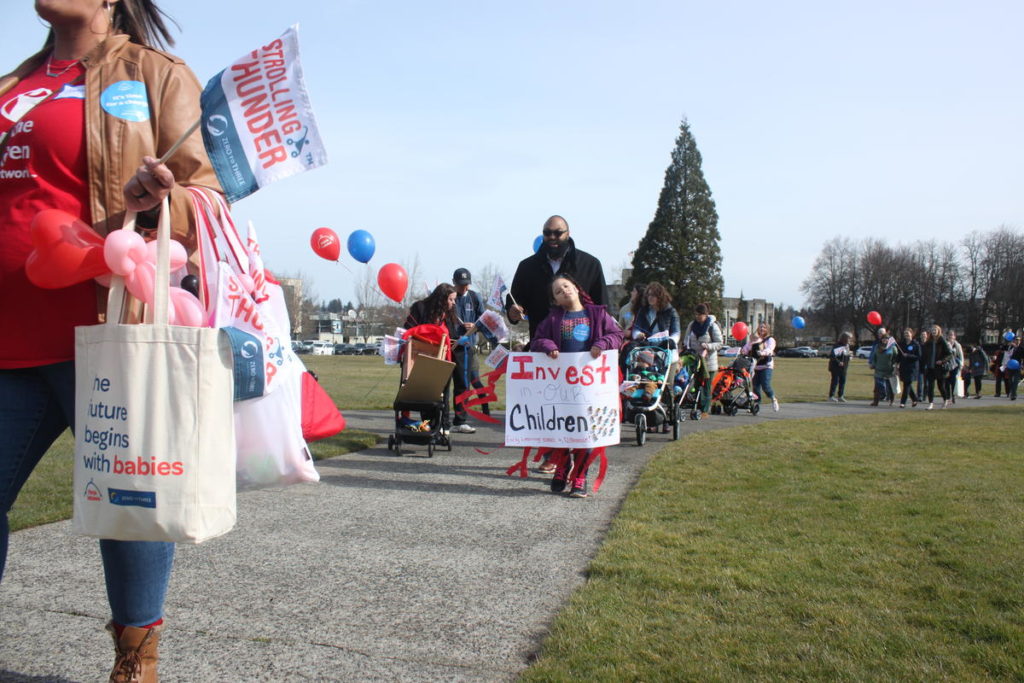 Advocates for deeper investments in early childhood care and learning programs gather during a march in Olympia, Washington, Thursday, March 14, 2019. CREDIT: MAX WASSERMAN