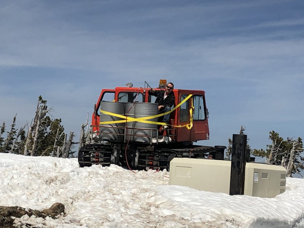 Engineer on snow cat, drums, fuel