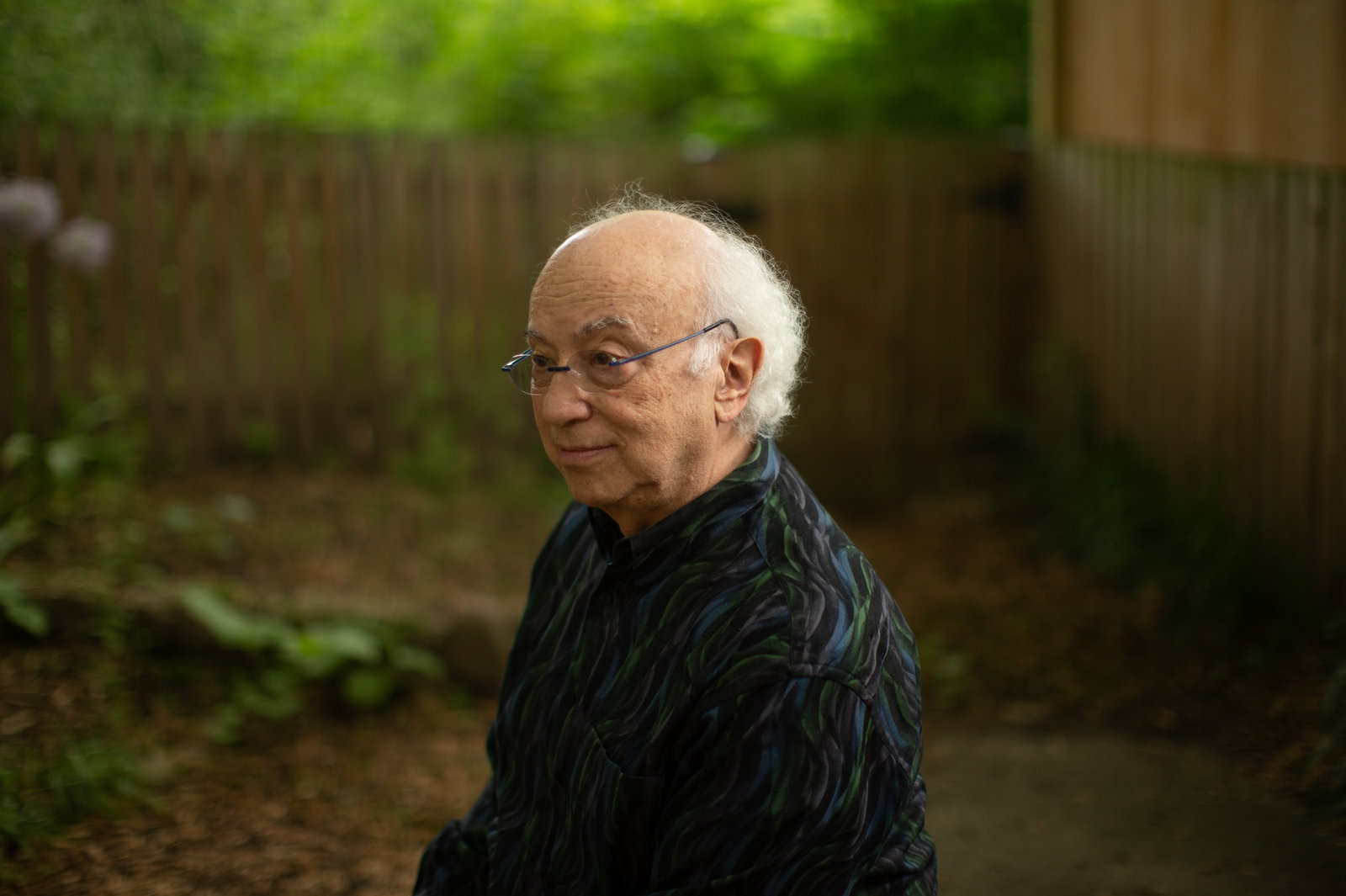 Rich Isaacson, seen in his backyard in Pentagon City, Va., wrote his thesis on gravitational waves and says he always thought their existence would be proved sometime during his career. But he didn't realize that trying to see them would become his career. CREDIT: Ryan Kellman/NPR