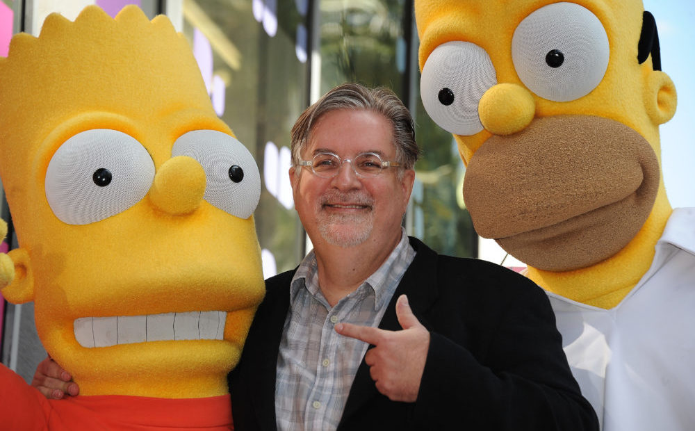 Cartoonist Matt Groening, creator of "The Simpsons," poses with his characters Bart (L) and Homer Simpson as he is honored with the 2,459th star on the Hollywood Walk of Fame February 14, 2012 in Hollywood, California. The 500th episode of the "The Simpsons" will air in the US on February 19th. CREDIT: Robyn Beck/AFP/Getty Images