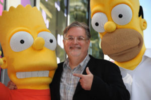 Cartoonist Matt Groening, creator of "The Simpsons," poses with his characters Bart (L) and Homer Simpson as he is honored with the 2,459th star on the Hollywood Walk of Fame February 14, 2012 in Hollywood, California. The 500th episode of the "The Simpsons" will air in the US on February 19th. CREDIT: Robyn Beck/AFP/Getty Images