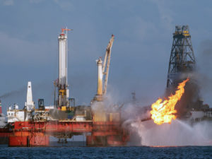 The Deepwater Horizon oil rig is seen here in July 2010, shortly before the Macondo well was capped after spilling oil for 87 days. The Trump administration has proposed revisions to Obama-era rules that aimed to prevent similar disasters. Dave Martin/Associated Press