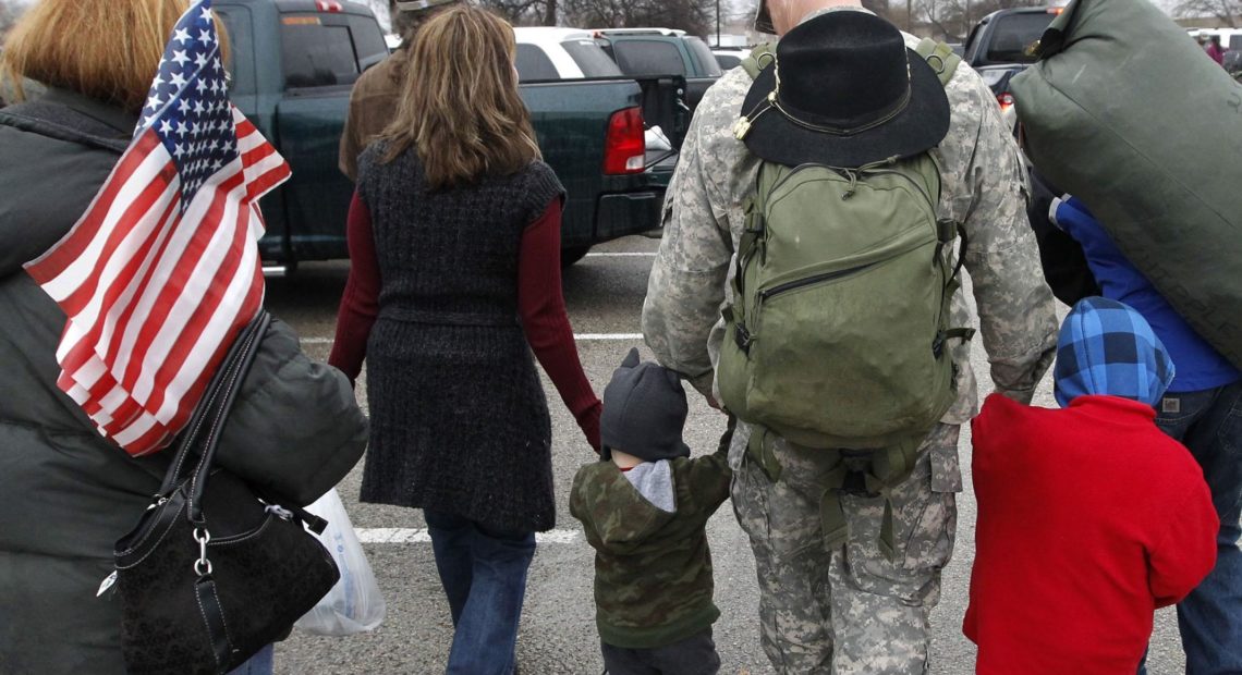 A soldier walks with his family following a 2011 ceremony at Fort Hood, Texas, for soldiers from the U.S. Army 1st Cavalry 3rd Brigade, who returned home from deployment in Iraq. CREDIT: Erich Schlegel/AP