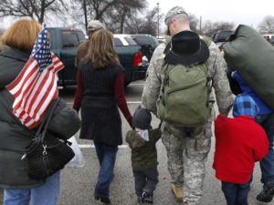A soldier walks with his family following a 2011 ceremony at Fort Hood, Texas, for soldiers from the U.S. Army 1st Cavalry 3rd Brigade, who returned home from deployment in Iraq. CREDIT: Erich Schlegel/AP