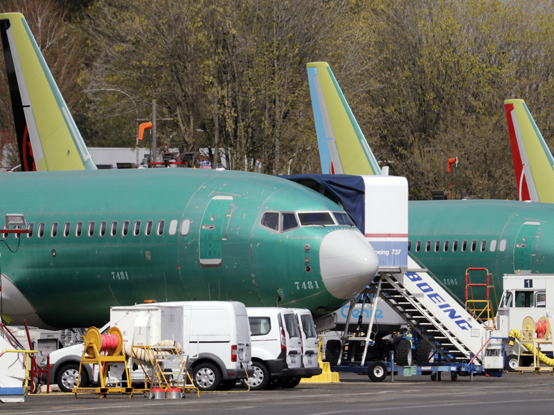 Boeing said on Sunday that it was aware of problems with a key safety indicator in 2017, but it didn't inform airlines or the FAA until after the Lion Air crash a year later. Here, 737 Max jets built for American Airlines (left) and Air Canada are parked at the airport adjacent to a Boeing production facility in Renton, Wash. CREDIT: ELAINE THOMPSON/AP