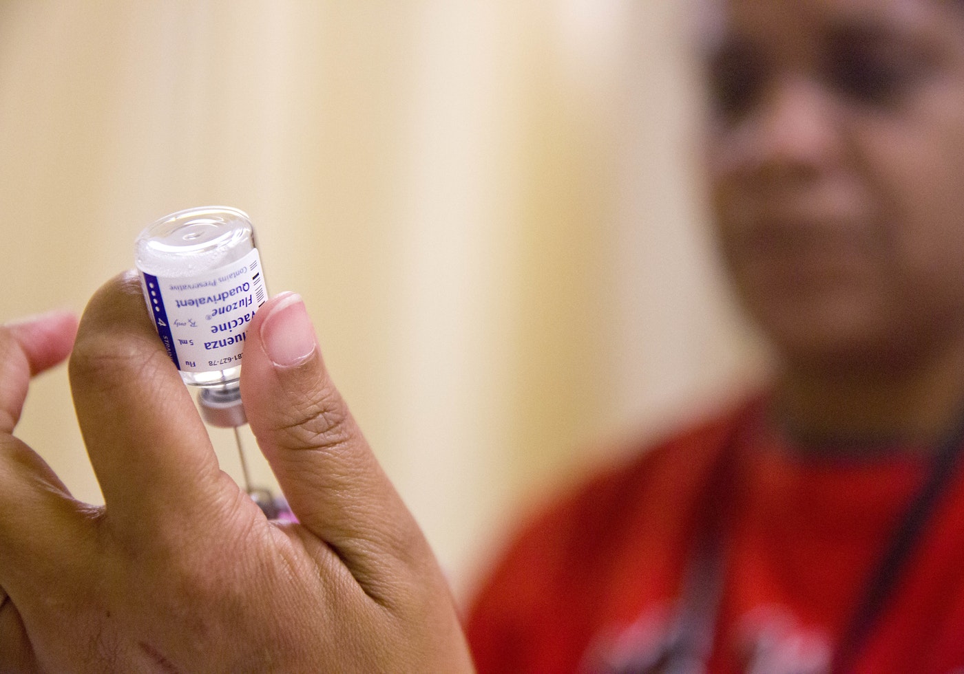A nurse prepares a flu shot from a vaccine vial at the Salvation Army in Atlanta. CREDIT: AP PHOTO/DAVID GOLDMAN