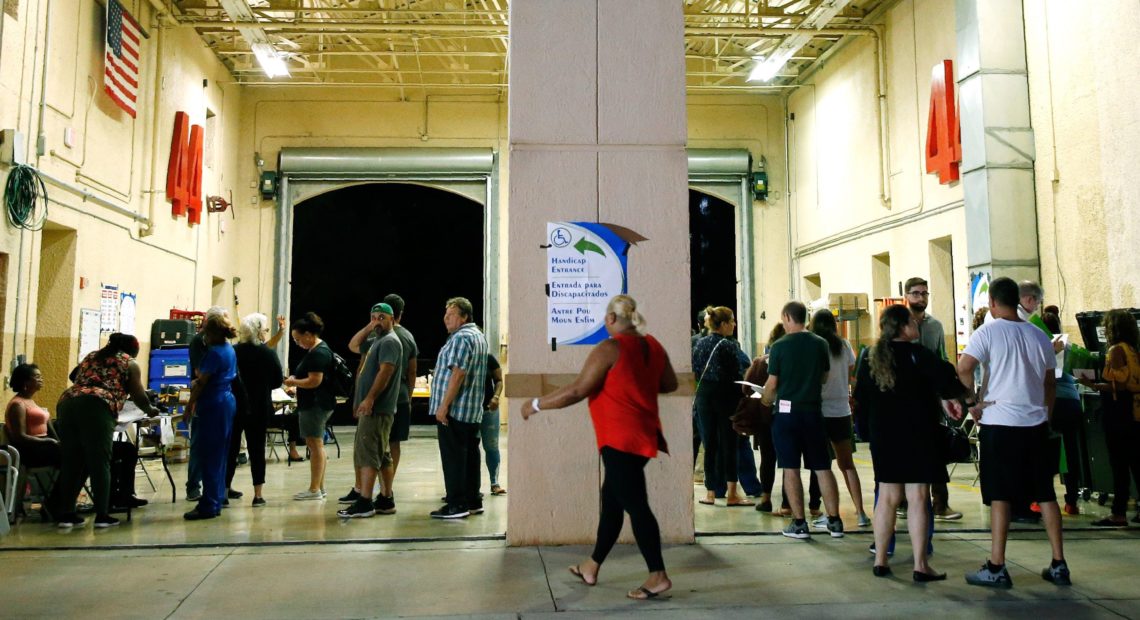 South Florida voters wait in line to cast their ballots late in the day at a busy polling center in Miami on Nov. 6, 2018. Rhona Wise/AFP/Getty Images
