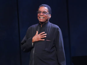 "It's about more than being American, or Australian, or any particular group. But it celebrates the cultures of all the groups. This is what jazz really does," Herbie Hancock tells NPR. Here, Hancoock is pictured onstage during the International Jazz Day 2019 All-Star Global Concert. Graham Denholm/Getty Images for Herbie Hancock