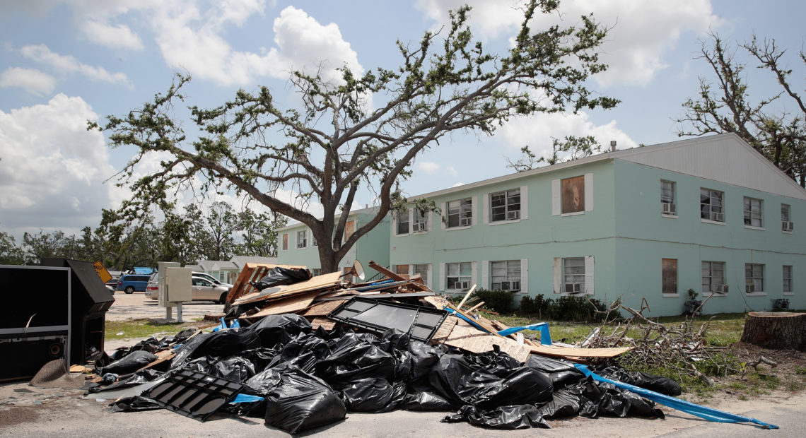 Debris is piled on May 10 outside an apartment complex that was damaged by Hurricane Michael in Panama City, Fla. Rep. Chip Roy objected to a procedural vote on a bipartisan $19.1 billion disaster aid bill, forcing Congress to wait until June to finish work on the legislation. Scott Olson/Getty Images