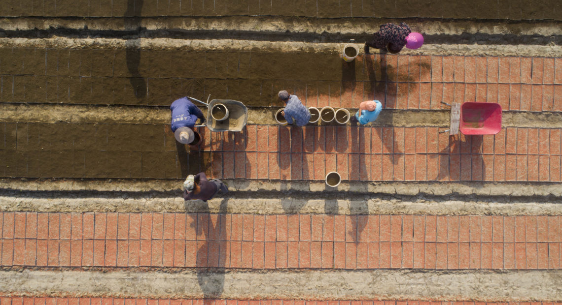 The new U.S. tariffs list includes staples such as rice, along with clocks, watches and other items that weren't previously under threat of new duties. Here, farmers plant rice seeds at a seedlings pool in China's Jiangsu province. Xu Jingbai/VCG via Getty Images