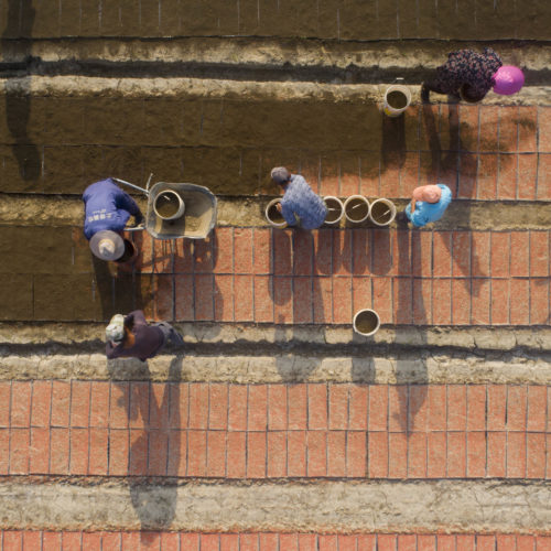 The new U.S. tariffs list includes staples such as rice, along with clocks, watches and other items that weren't previously under threat of new duties. Here, farmers plant rice seeds at a seedlings pool in China's Jiangsu province. Xu Jingbai/VCG via Getty Images