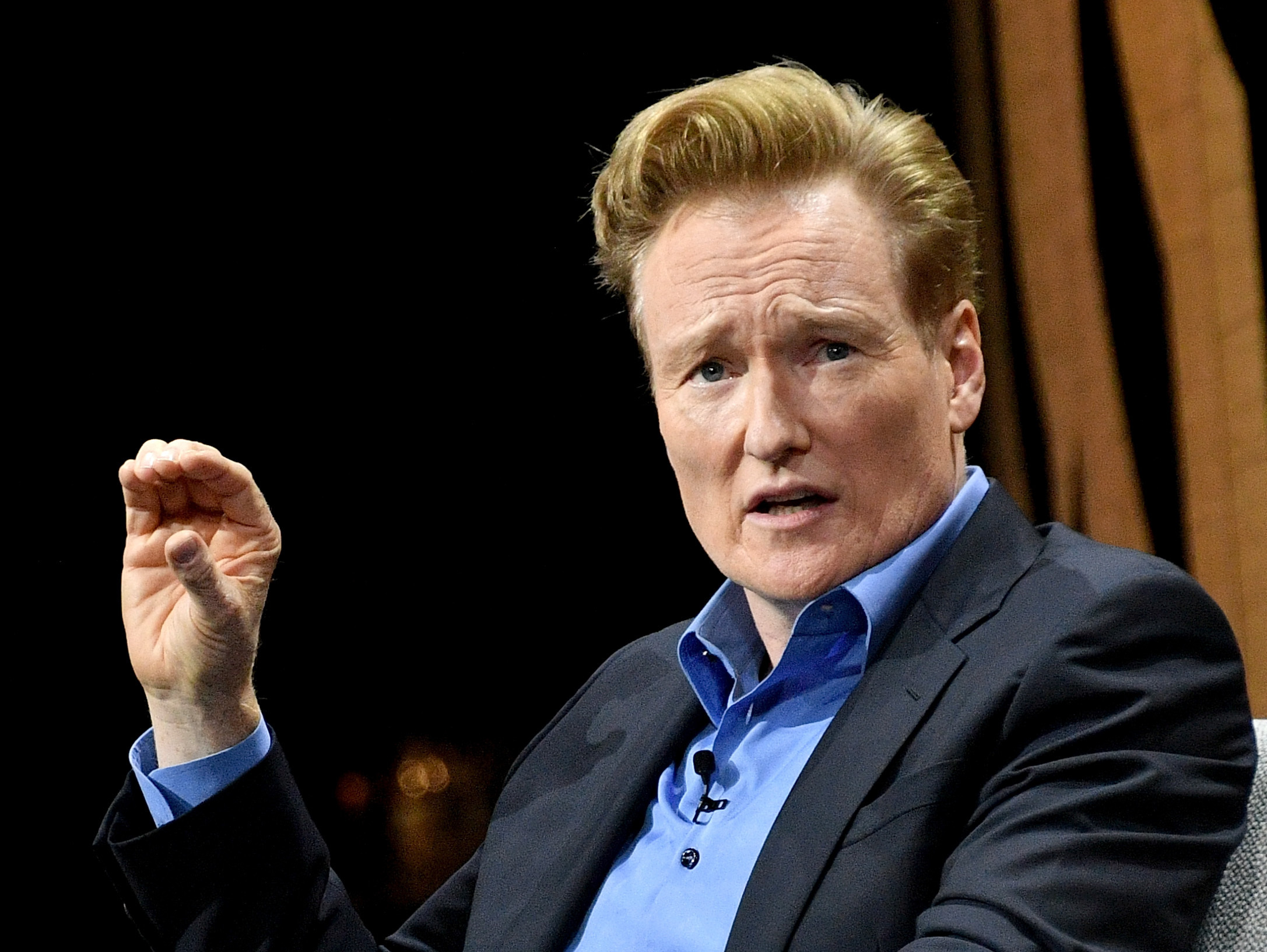 Late night TV host Conan O'Brien, pictured in 2016, has settled a lawsuit with a man who accused O'Brien and his writing staff of stealing his jokes. Mike Windle/Getty Images for Vanity Fair