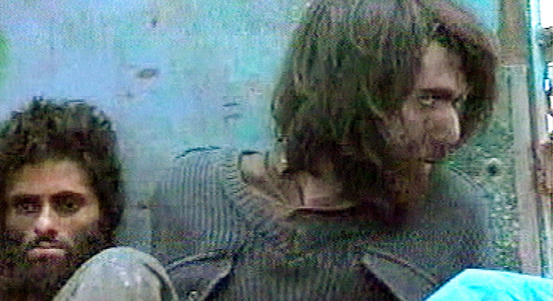This image from television footage shows John Walker Lindh in Afghanistan on Dec. 1, 2001. Lindh was a Taliban soldier who was captured at that time. Having served 17 years of a 20-year sentence, he is scheduled to be released from a U.S. federal prison on Thursday. In the coming years, dozens of Americans linked to extremist groups are in line to be released from U.S. prisons. Associated Press