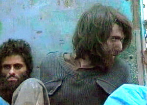 This image from television footage shows John Walker Lindh in Afghanistan on Dec. 1, 2001. Lindh was a Taliban soldier who was captured at that time. Having served 17 years of a 20-year sentence, he is scheduled to be released from a U.S. federal prison on Thursday. In the coming years, dozens of Americans linked to extremist groups are in line to be released from U.S. prisons. Associated Press
