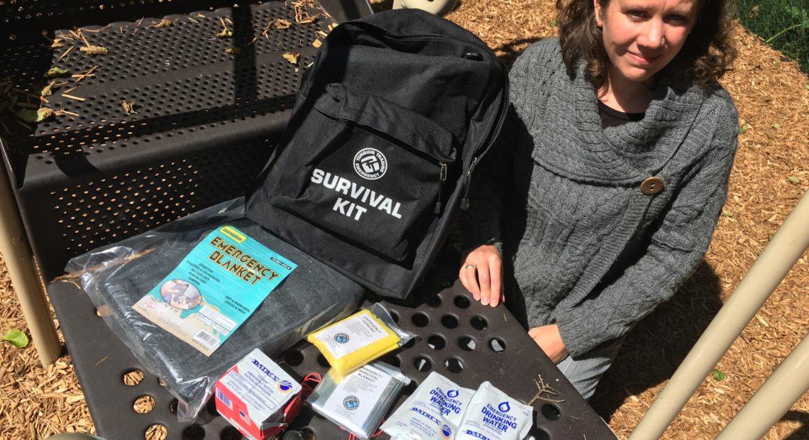 Cannon Beach Academy director Amy Fredrickson with one of the school's 55 survival kits. CREDIT: TOM BANSE / NW NEWS NETWORK