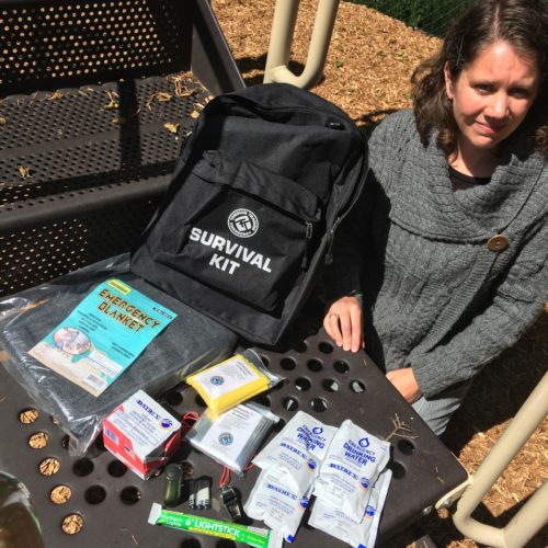 Cannon Beach Academy director Amy Fredrickson with one of the school's 55 survival kits. CREDIT: TOM BANSE / NW NEWS NETWORK