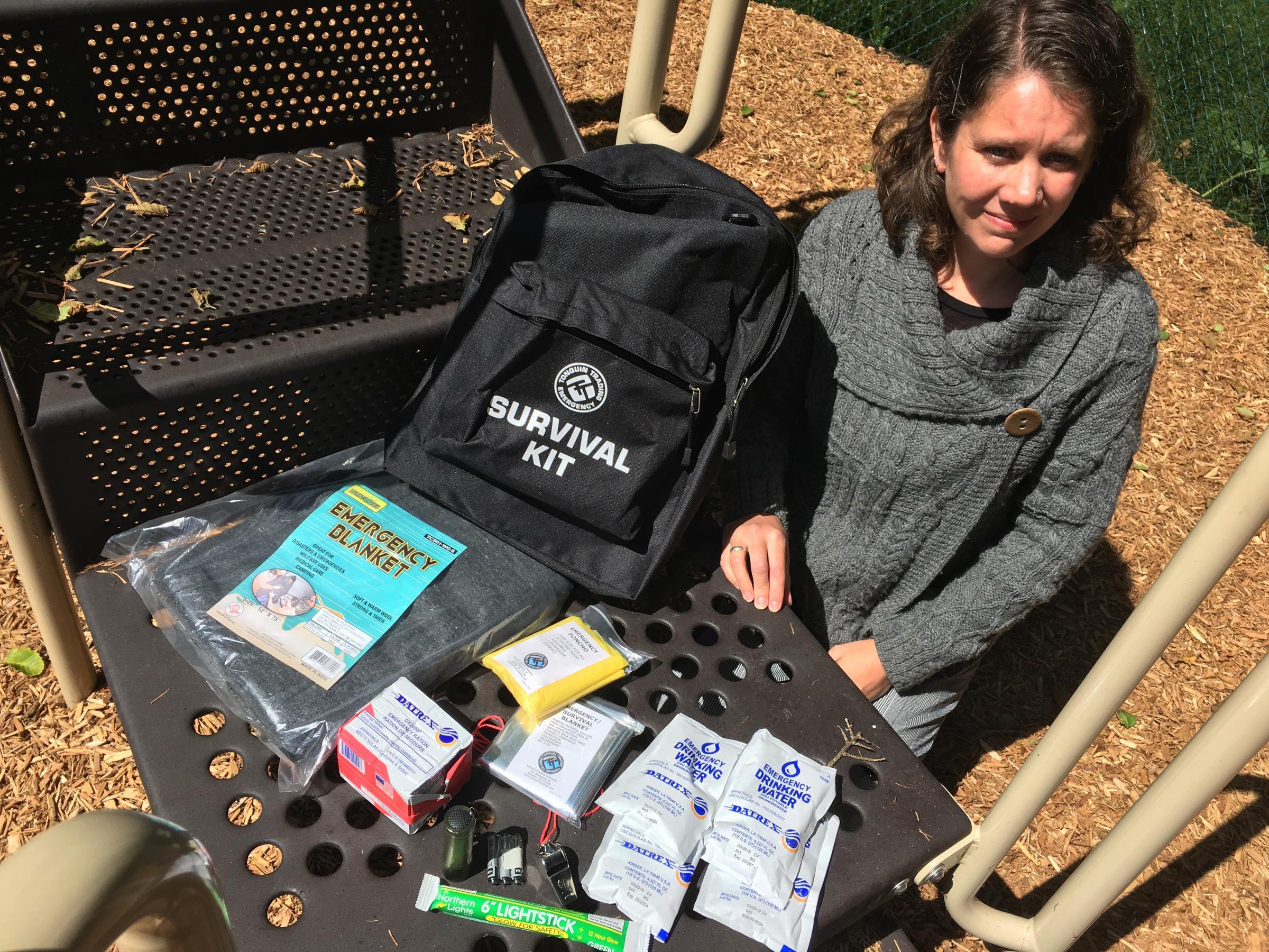 Cannon Beach Academy director Amy Fredrickson with one of the school's 55 survival kits. CREDIT: TOM BANSE / NW NEWS NETWORK