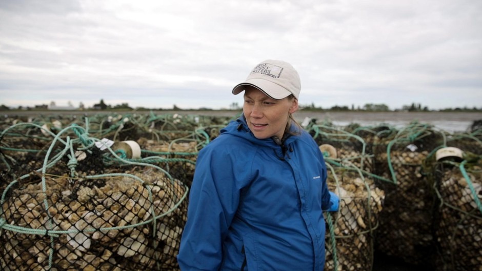 Kathleen Nisbet Moncy is a second generation oyster farmer. Her family has been farming in Willapa Bay for the past four decades. CREDIT: KAYLEE DOMZALSKI/OPB