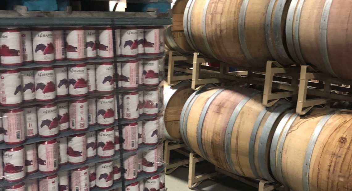 Pallets of 14 Hands canned wines are ready to ship at Columbia Crest winery near Paterson, Wash.