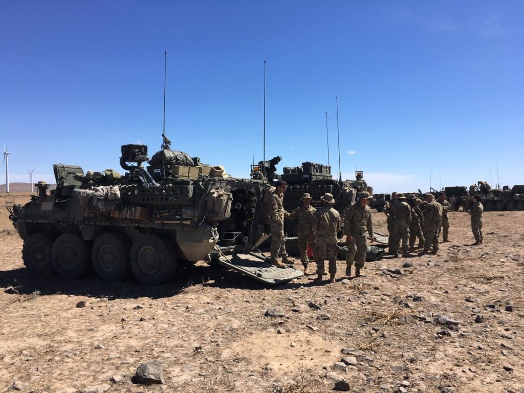 Members of the Washington Army National Guard's 81st Combat Brigade with their Stryker vehicles at the Yakima Training Ground. CREDIT: AUSTIN JENKINS/N3