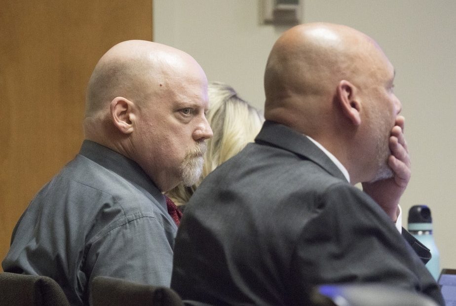 William Talbott II, left, stares at his attorney Jon Scott after Scott presented his opening statement in Talbott' trial for double-murder , Friday, June 14, 2019, at the Snohomish County Courthouse in Everett. CREDIT: ANDY BRONSON/THE HERALD via AP