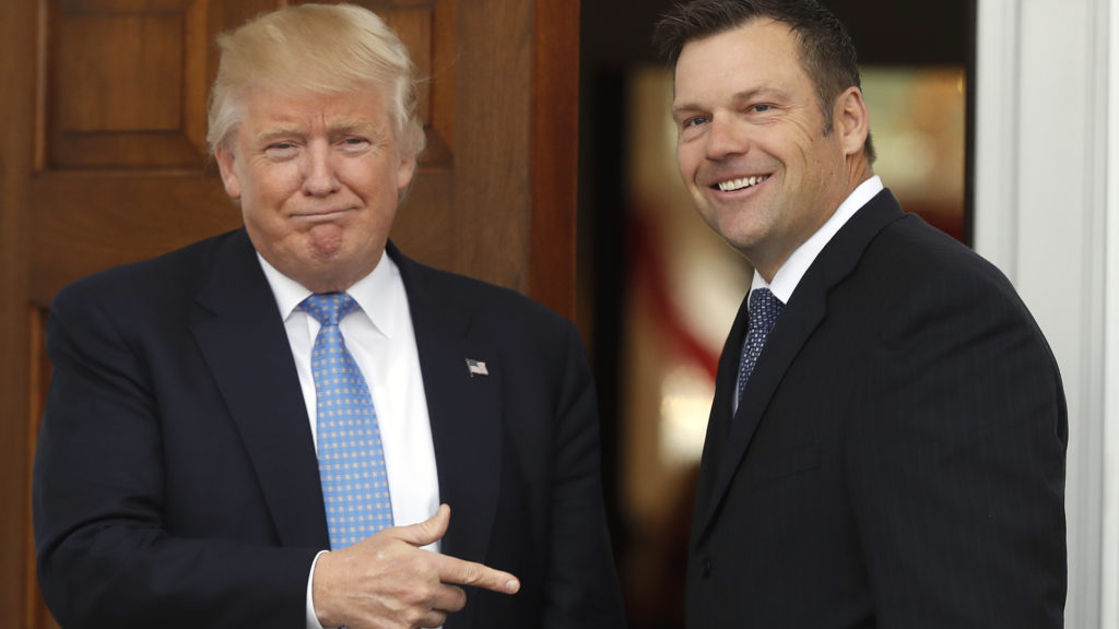 Former Kansas Secretary of State Kris Kobach is greeted by President Trump in 2016 at the Trump National Golf Club Bedminster clubhouse in Bedminster, N.J. Carolyn Kaster/AP