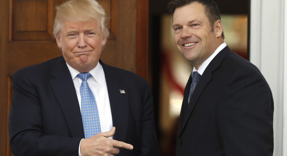 Former Kansas Secretary of State Kris Kobach is greeted by President Trump in 2016 at the Trump National Golf Club Bedminster clubhouse in Bedminster, N.J. Carolyn Kaster/AP