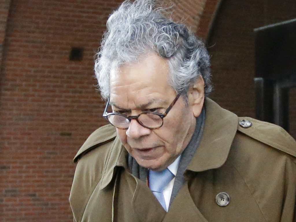 Insys Therapeutics founder John Kapoor departs federal court in Boston, Jan. 30. On Monday the company filed for Chapter 11 bankruptcy, saying it needs to sell its assets to pay back creditors. Kapoor, who was convicted last month of racketeering, owns more than 63% of the company. Steven Senne/AP