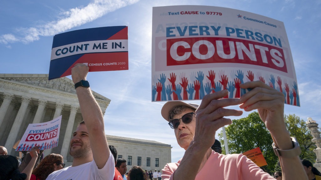 Demonstrators rally outside the Supreme Court in April as the justices hear arguments over the Trump administration's plan to add a citizenship question to 2020 census forms. J. Scott Applewhite/AP