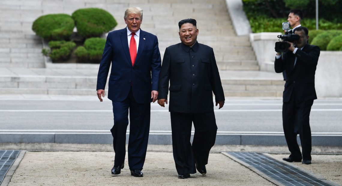 North Korean leader Kim Jong Un walks with President Trump north of the military demarcation line that divides North and South Korea, in the Joint Security Area of Panmunjom in the Demilitarized Zone, on Sunday. Brendan Smialowski/AFP/Getty Images