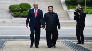 North Korean leader Kim Jong Un walks with President Trump north of the military demarcation line that divides North and South Korea, in the Joint Security Area of Panmunjom in the Demilitarized Zone, on Sunday. Brendan Smialowski/AFP/Getty Images