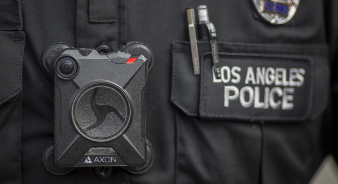 A Los Angeles police officer wears an Axon body camera in 2017. On Thursday, the company announced it is holding off on facial recognition software, citing its unreliability. David McNew/Getty Images