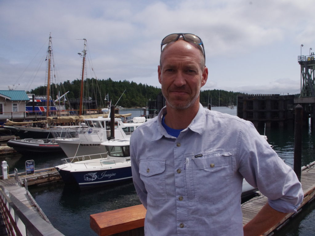 Brian Goodremont is owner of San Juan Safaris, a whale watching company in Friday Harbor, Wash. He says tour boats follow guidelines to "mitigate" any disturbance to the orcas. Martin Kaste/Martin Kaste