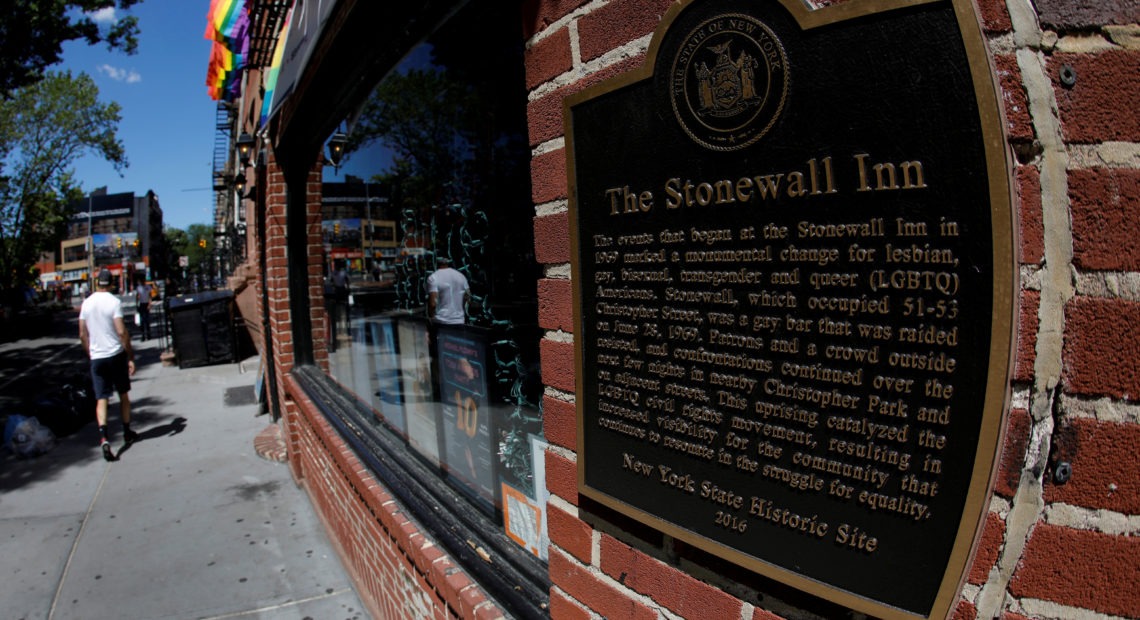 A man walks past New York's Stonewall Inn, site of the 1969 uprising considered the birth of the LGBTQ movement. CREDIT: Mike Segar/Reuters