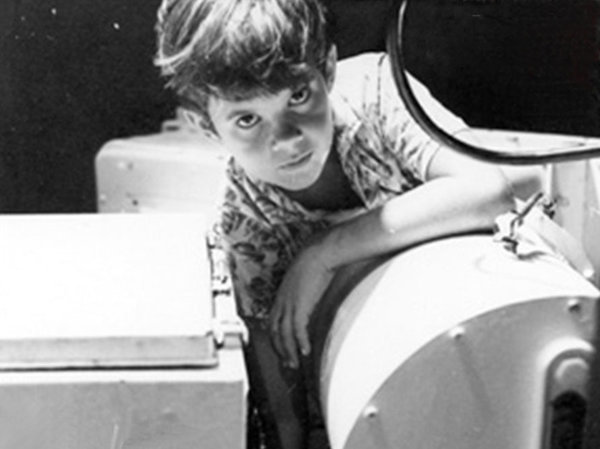 Ten-year-old Greg Force in 1969, greasing the antenna bearing at the NASA tracking station in Guam. Courtesy of Greg Force
