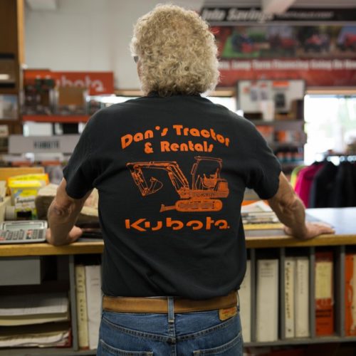 Dan’s Tractor Inc. owner Skip Ogden stands at the counter of his southwestern Washington store. CREDIT: Kate Davidson/OPB