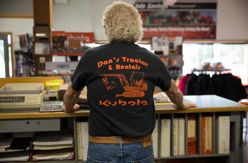 Dan’s Tractor Inc. owner Skip Ogden stands at the counter of his southwestern Washington store. CREDIT: Kate Davidson/OPB