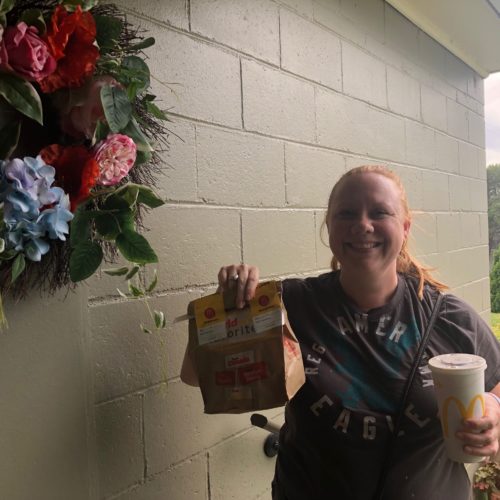 Food delivery driver Crystal Begallia delivers McDonald’s fries and cheeseburgers to Anna King’s door for a public radio experiment.