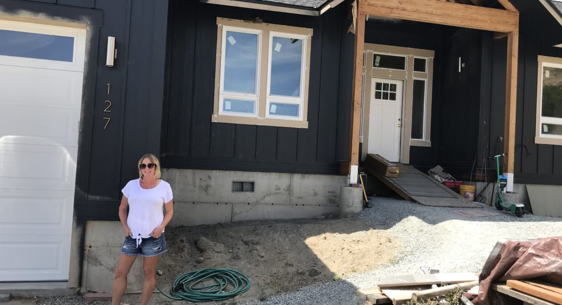 Libby Harrison, who at the time was the mayor of Pateros, and her husband are rebuilding their home, which burned in the 2014 Carlton Complex. They’re doing most of the work themselves and hope to move back in, in a few months. CREDIT: Courtney Flatt/NWPB