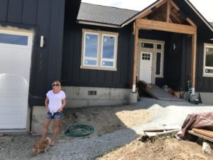 Libby Harrison, who at the time was the mayor of Pateros, and her husband are rebuilding their home, which burned in the 2014 Carlton Complex. They’re doing most of the work themselves and hope to move back in, in a few months. CREDIT: Courtney Flatt/NWPB
