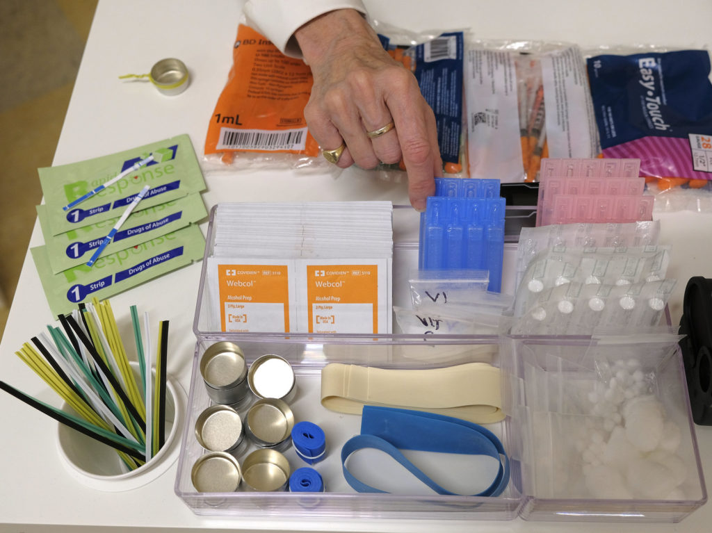Supplies sit on a check-in desk at a model of a hypothetical injection site in San Francisco, pictured here in September 2018. Local leaders from San Francisco are among a dozen local officials urging a federal court to allow an effort to open a supervised injection site in Philadelphia. Eric Risberg/AP