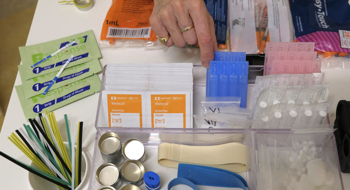 Supplies sit on a check-in desk at a model of a hypothetical injection site in San Francisco, pictured here in September 2018. Local leaders from San Francisco are among a dozen local officials urging a federal court to allow an effort to open a supervised injection site in Philadelphia. Eric Risberg/AP