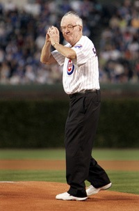 Justice John Paul Stevens, a Chicago native, throws out the first pitch before the Chicago Cubs game Sept. 14, 2005, at Wrigley Field in Chicago. Jeff Roberson/AP