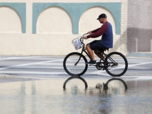 A street in Miami flooded during a high tide in 2018. A new report confirms that the number of days with high-tide flooding is increasing in many U.S. cities as sea levels rise. Wilfredo Lee/AP