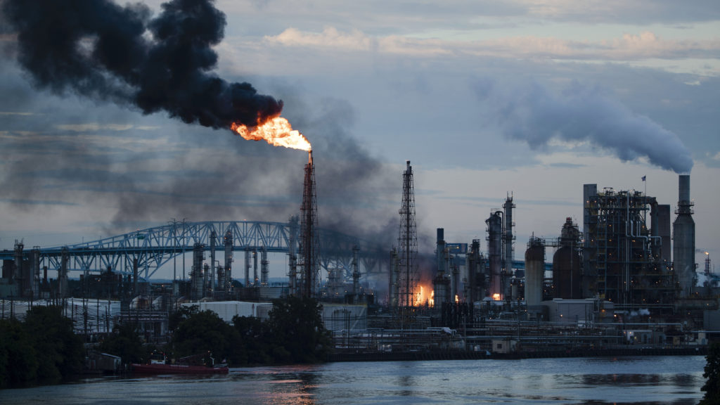 Flames and smoke emerge from the Philadelphia Energy Solutions refinery in Philadelphia on June 21. Experts say the explosions could have been far more devastating if deadly hydrogen fluoride had been released. CREDIT: Matt Rourke/AP