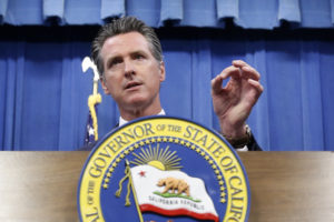 California Gov. Gavin Newsom signed a bill into law Tuesday that would require presidential candidates to release several years of tax returns to be on the primary ballot in the state. Rich Pedroncelli/AP