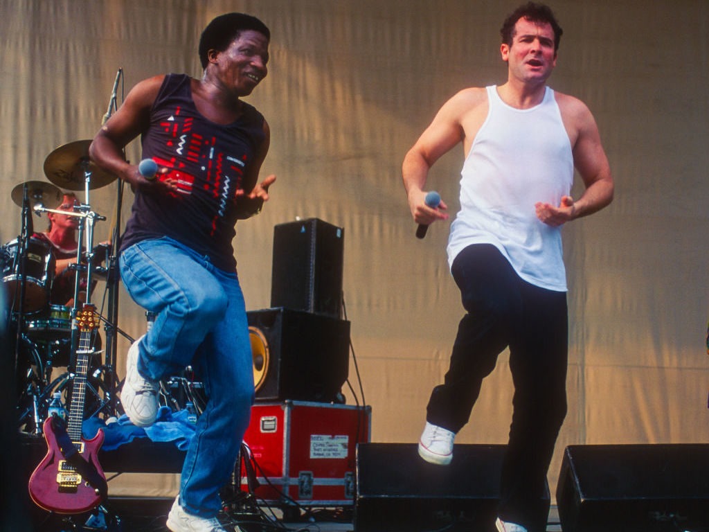 South African musician Johnny Clegg, right, with his longtime bandmate Sipho Mchunu, performing in New York City in 1996. Clegg died Tuesday at age 66. Jack Vartoogian/Getty Images