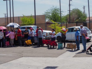 Every month, a food bank is set up at the community center in Heber, and some 250 families line up for free food. CREDIT: JIM ZARROLI/NPR