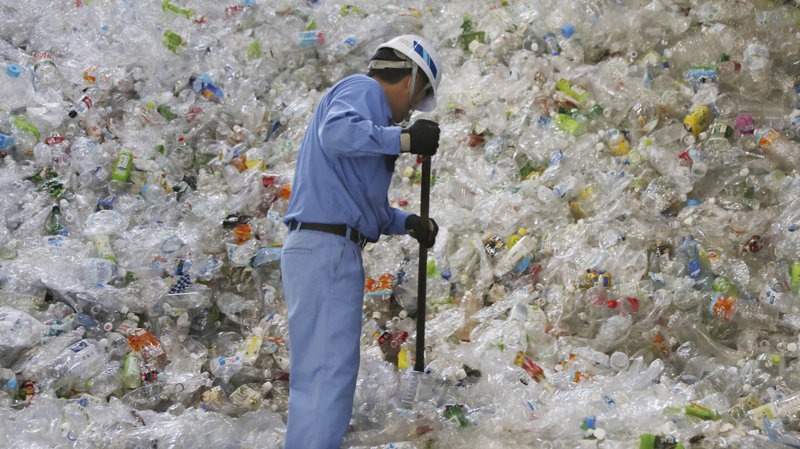 By one estimate, emissions from producing and incinerating plastics could amount to 56 gigatons of carbon — almost 50 times the annual emissions of all of the coal power plants in the U.S. — between now and 2050. CREDIT: KOJI SASAHARA/AP